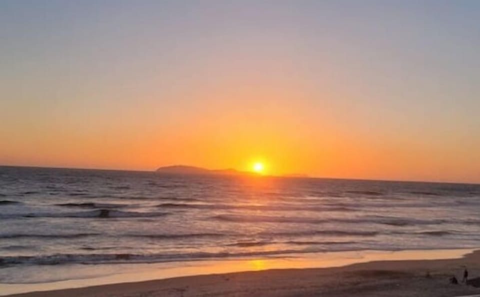 Sun going down behind islands. 