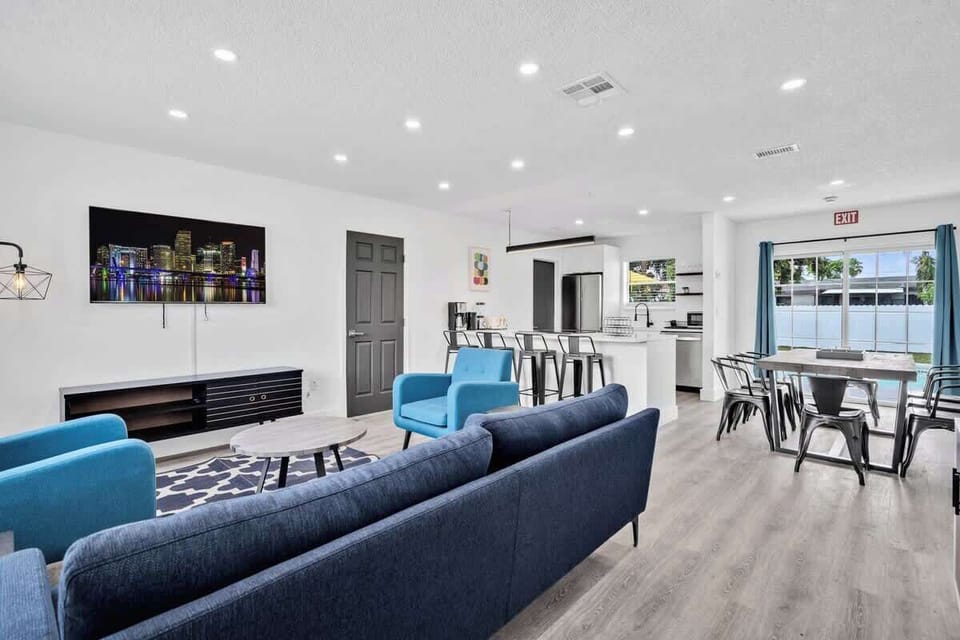 Enjoy this spacious open-concept layout with stylish seating, modern kitchen, and natural light — perfect for group stays.