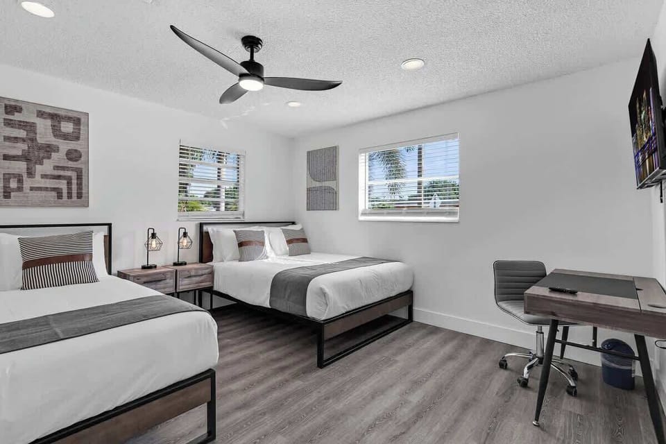 Ideal for friends or solo travelers—this cozy twin-bed room features a work desk, smart TV, and modern decor. Your perfect Airbnb base for exploring or relaxing.