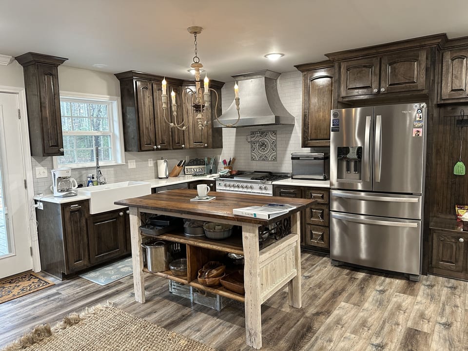 Chef's kitchen with gas range and double ovens.