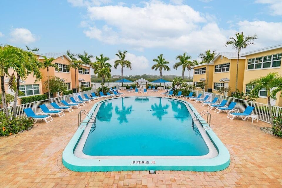 Beautiful pool with many lounge chairs.