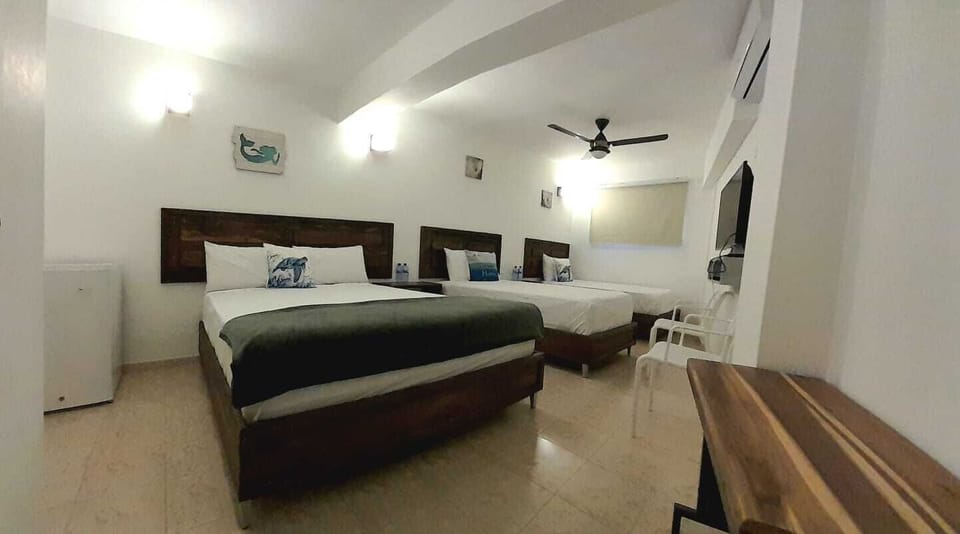 Family Triple Room | Pillowtop beds, free minibar, individually decorated