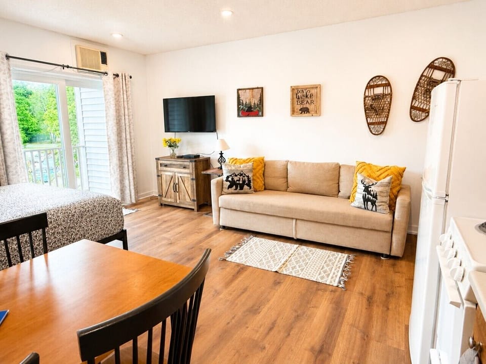 Our Smart TV and comfy Queen Sofa Bed