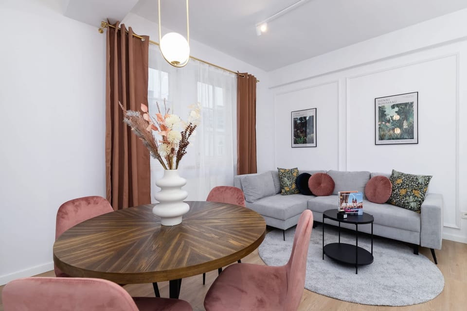 A cozy dining corner with a bouquet of flowers as a centerpiece.
