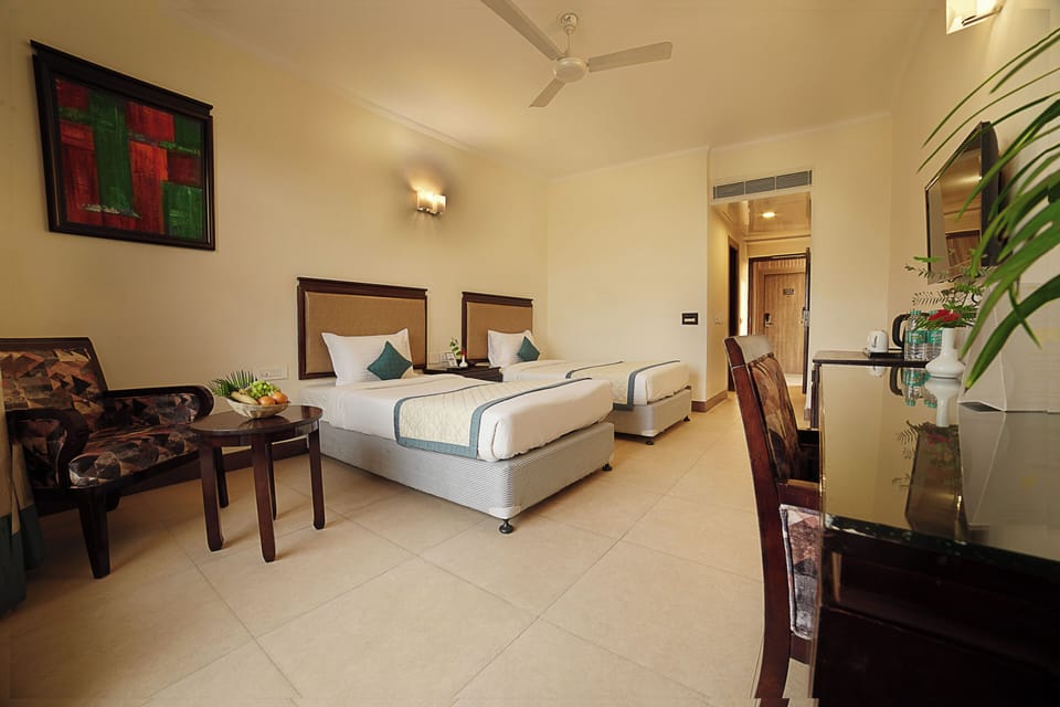 Deluxe Room with Private Balcony | Egyptian cotton sheets, premium bedding, down comforters, in-room safe