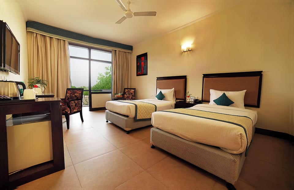Deluxe Room with Private Balcony | Egyptian cotton sheets, premium bedding, down comforters, in-room safe