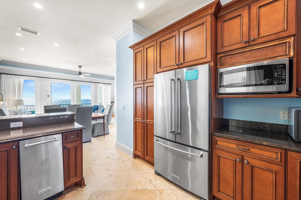 Kitchen with a View!! Second Floor Fully Stocked  with Granite Countertops, Stainless Steel Appliances including Viking Range, KitchenAid Refrigerator, and Under-Counter Ice Maker.