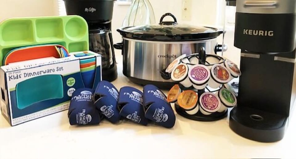 KITCHEN ESSENTIALS ALWAYS INCLUDED: Drip and Keurig Coffee Makers with K-cups, Kids Dinnerware Set, Coozies and Slow Cooker.