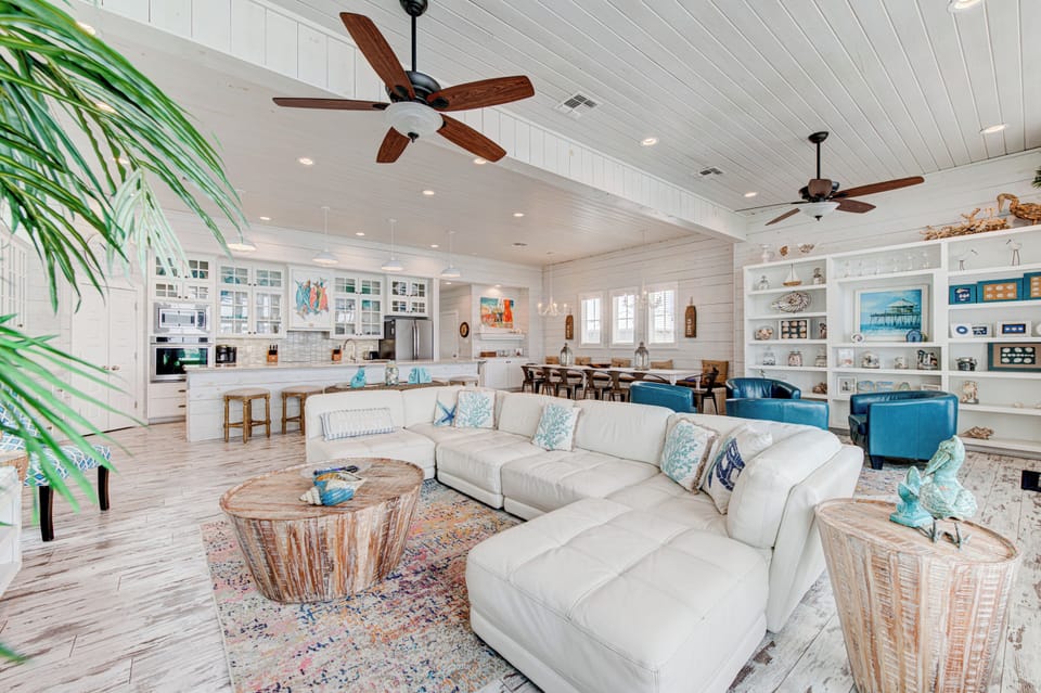 Sink into this airy coastal haven where your mornings begin with ocean breezes and evenings unfold in pure comfort.