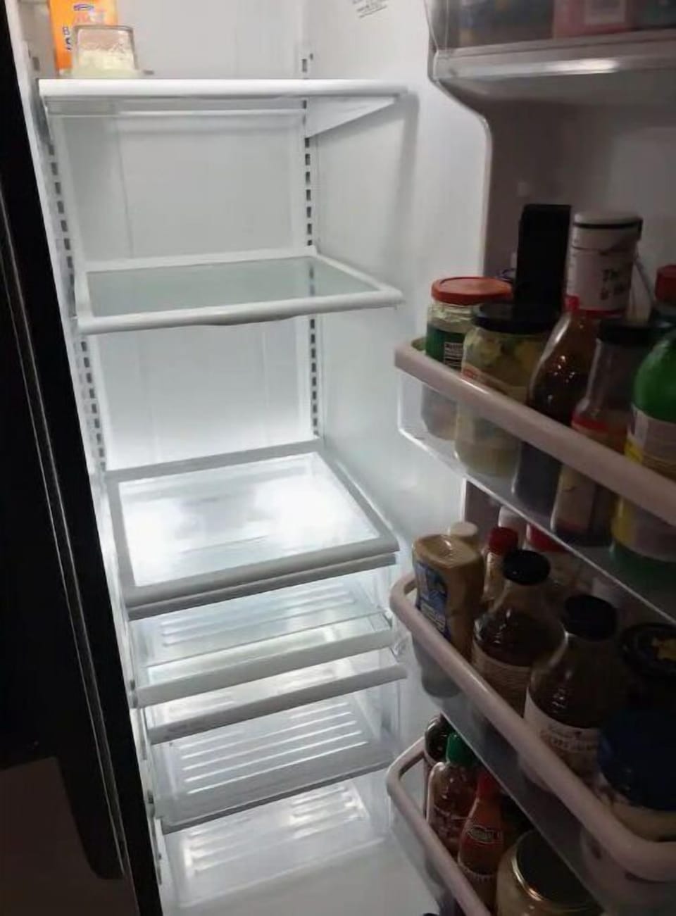 large fridge with some condiments provided. 