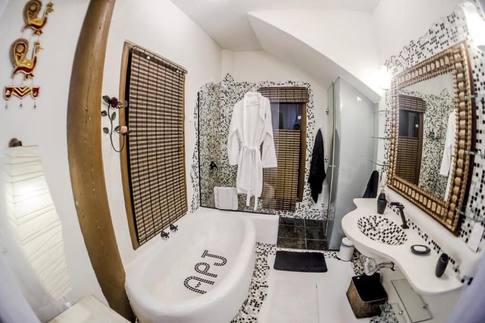 Suite, Ocean View | Bathroom | Shower, hydromassage showerhead, free toiletries, hair dryer