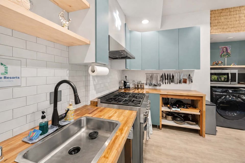 Bright Modern Kitchen with Gas Range and Wood Countertops — Practical Layout for Cooking, Prep, and Shared Use