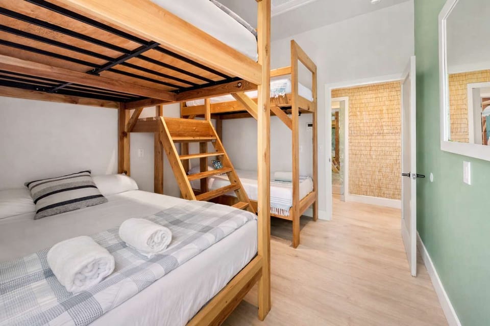 Spacious Loft Bedroom with Two Queen Beds, Wooden Bunk Bed & Bright Natural Light — Perfect for Families or Group Stays