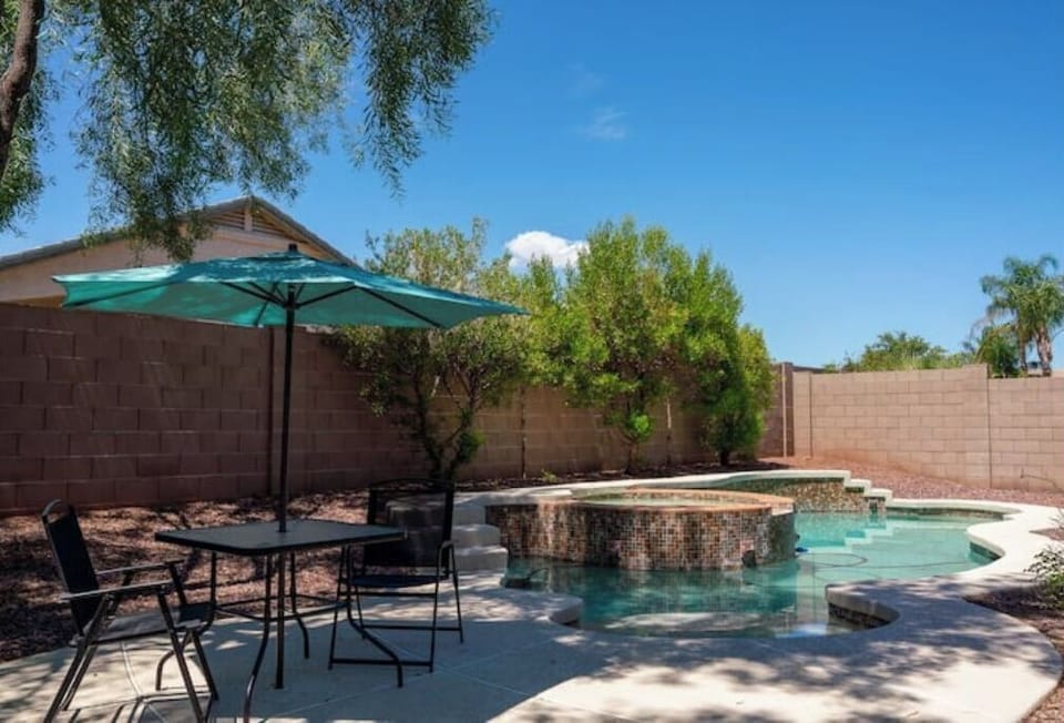 Well shaded pool with high walls for privacy. Heated spa.