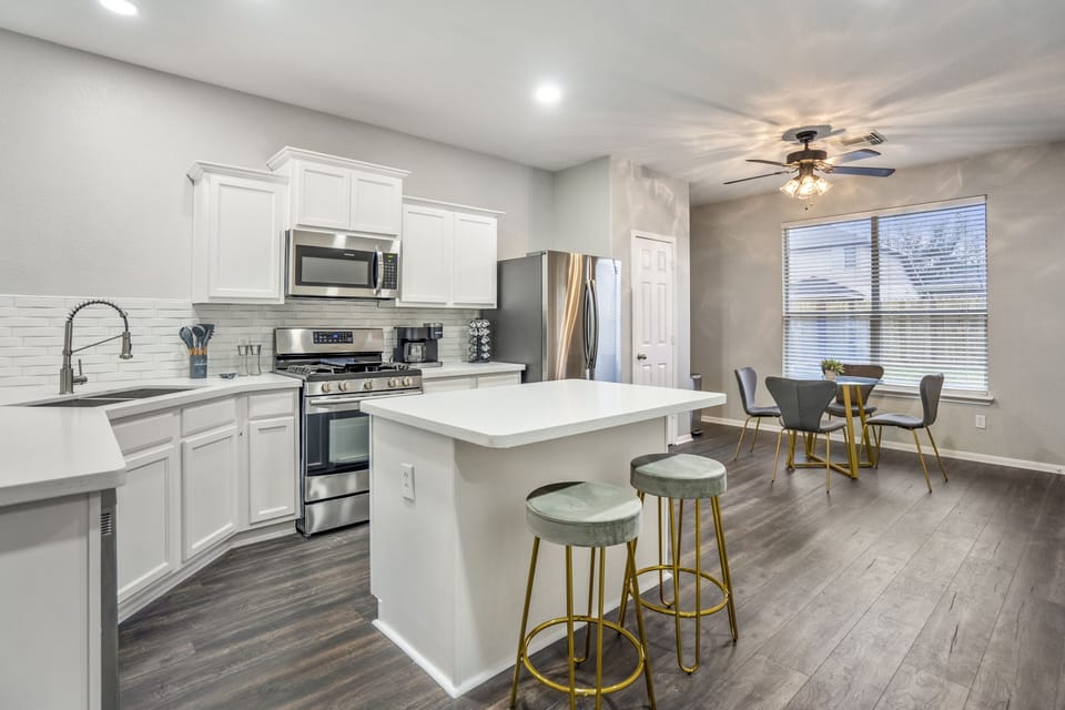 Sleek finishes and top-tier appliances define this stylish kitchen.