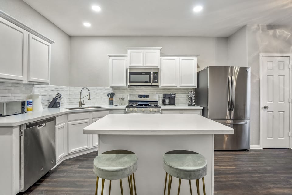 Our modern kitchen boasts high-end appliances and chic design.