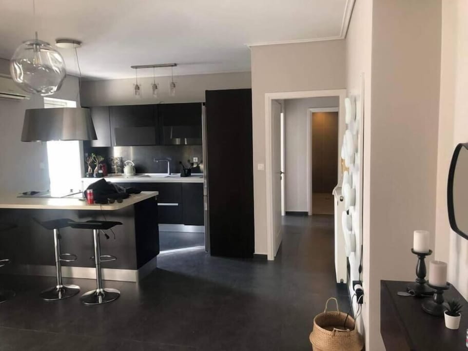 Executive Apartment | Living area | 55-inch LED TV with cable channels, TV, fireplace