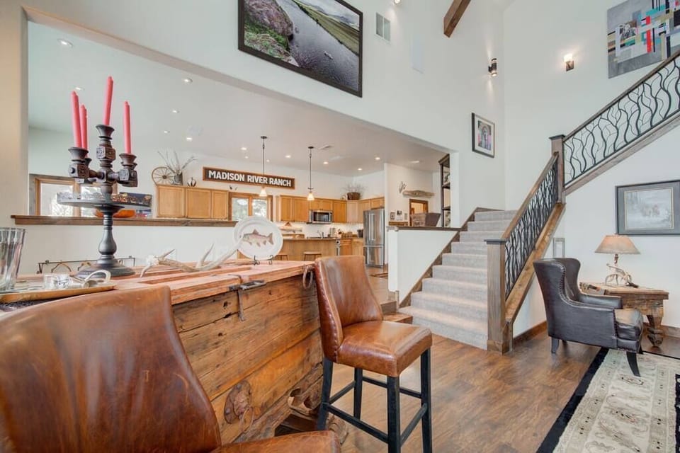 The living area is open to the kitchen and offers multiple seating areas. 