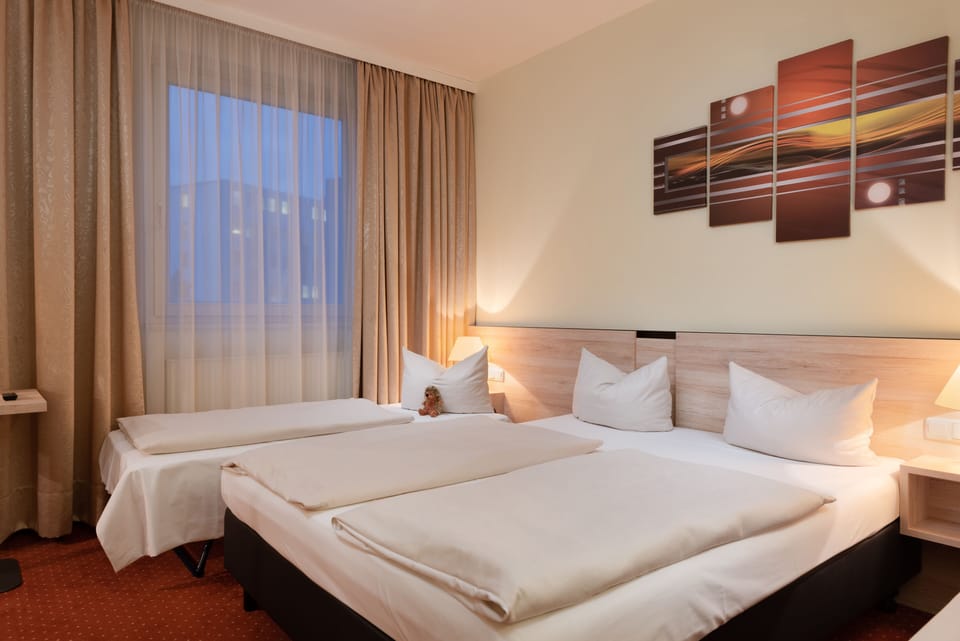 Hypo-allergenic bedding, desk, blackout drapes, soundproofing