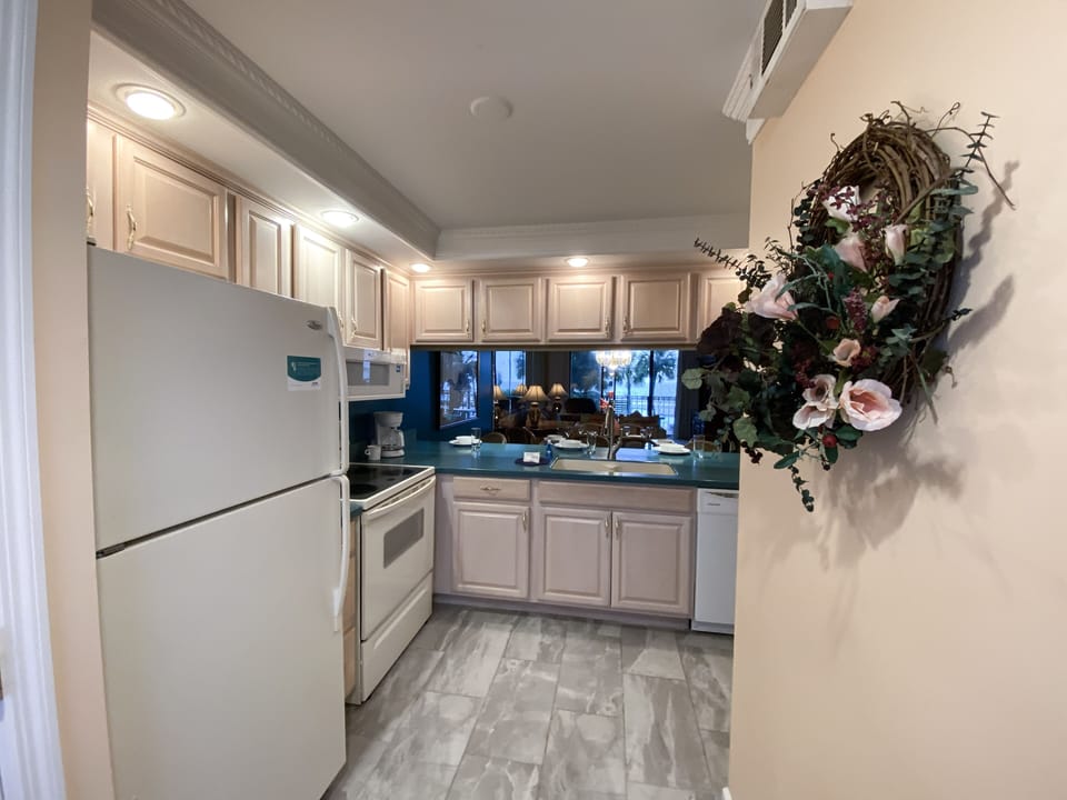 The kitchen provides a full fridge, stove, dishwasher and microwave.