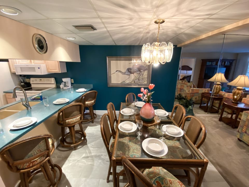The dining room comfortably sits 9 people. Six at the main table and 3 more at the bar.