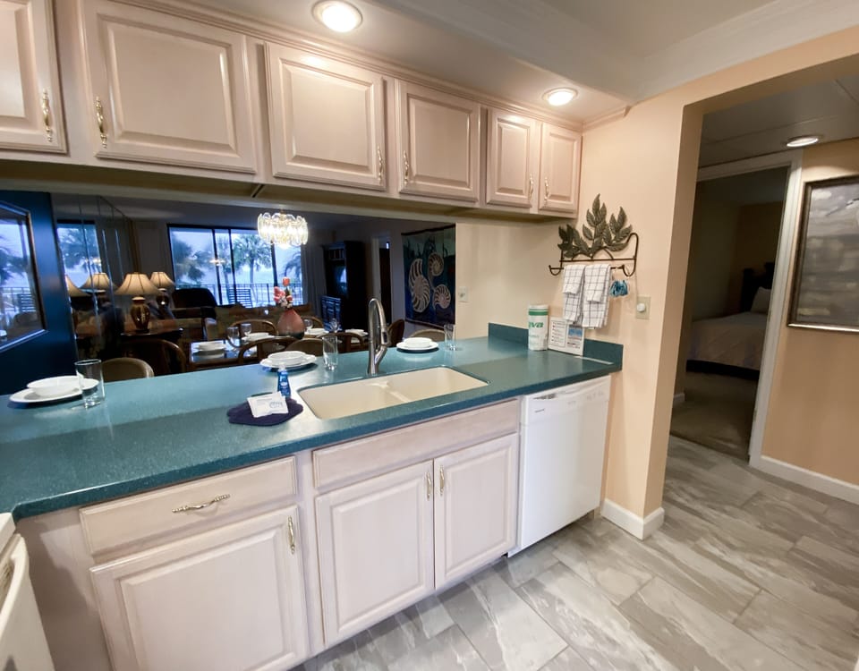 Kitchen is located to the left off the hallway.