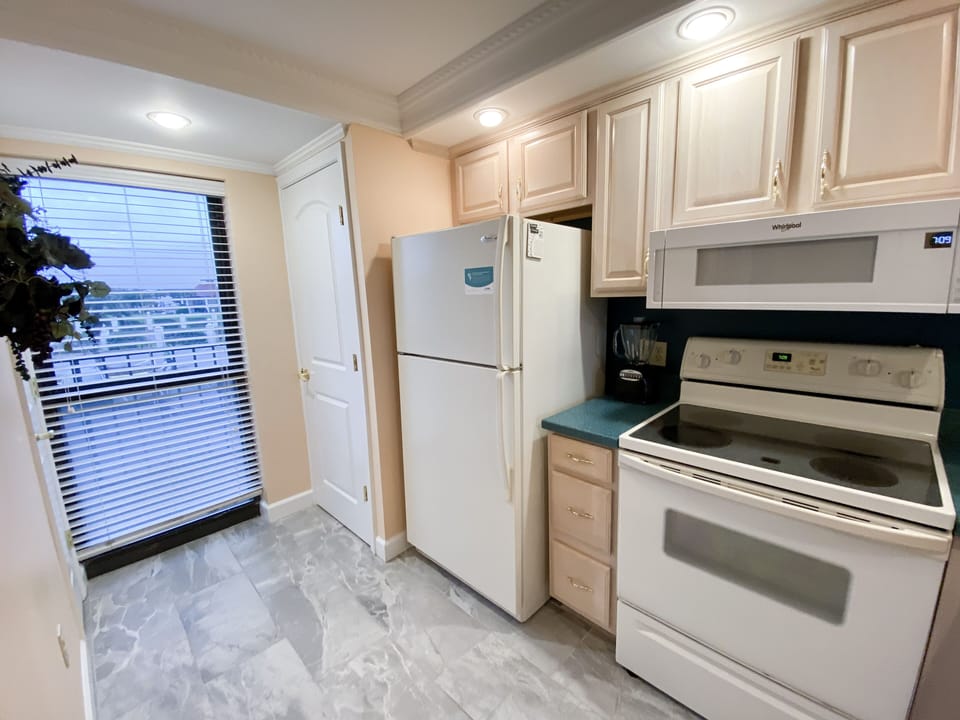Kitchen with a pantry.