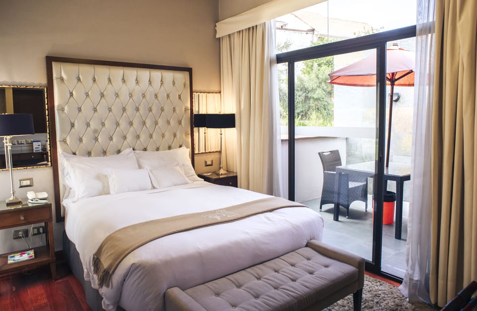 Deluxe Suite, Jetted Tub | Premium bedding, down comforters, in-room safe, desk