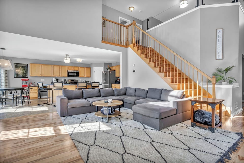 Spacious living room with fire place and lots of seating