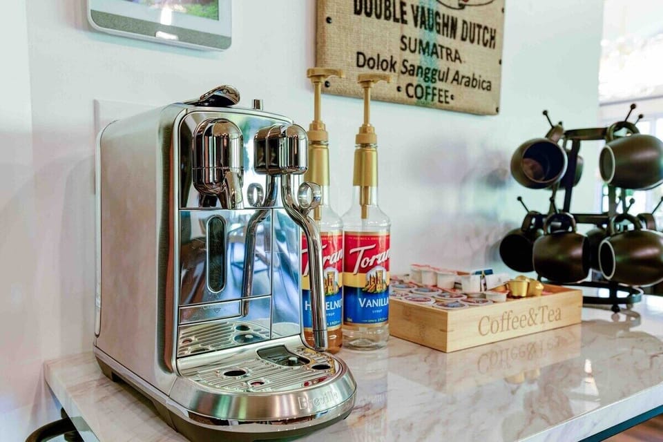 Nespresso coffee station with a variety of cream & sugar. We also have a Keurig and a regular drip coffee maker.