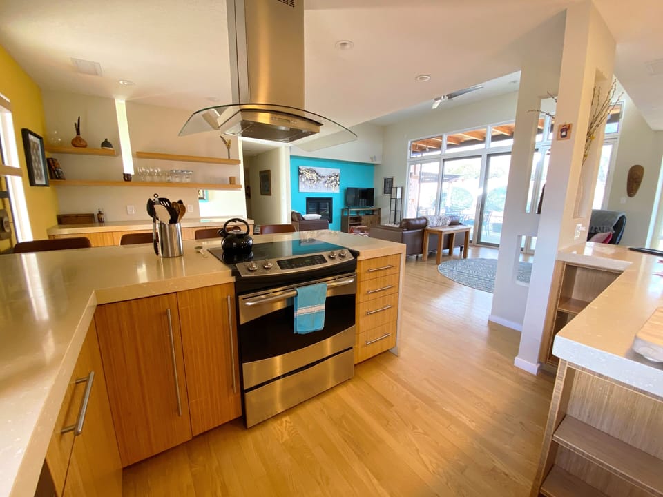 Kitchen open to dining room, living room and bar 