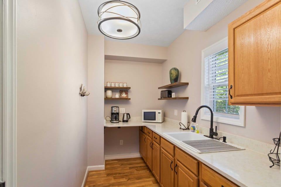 Lower Level Kitchenette with Full Fridge, Sink, Coffee Maker and Microwave