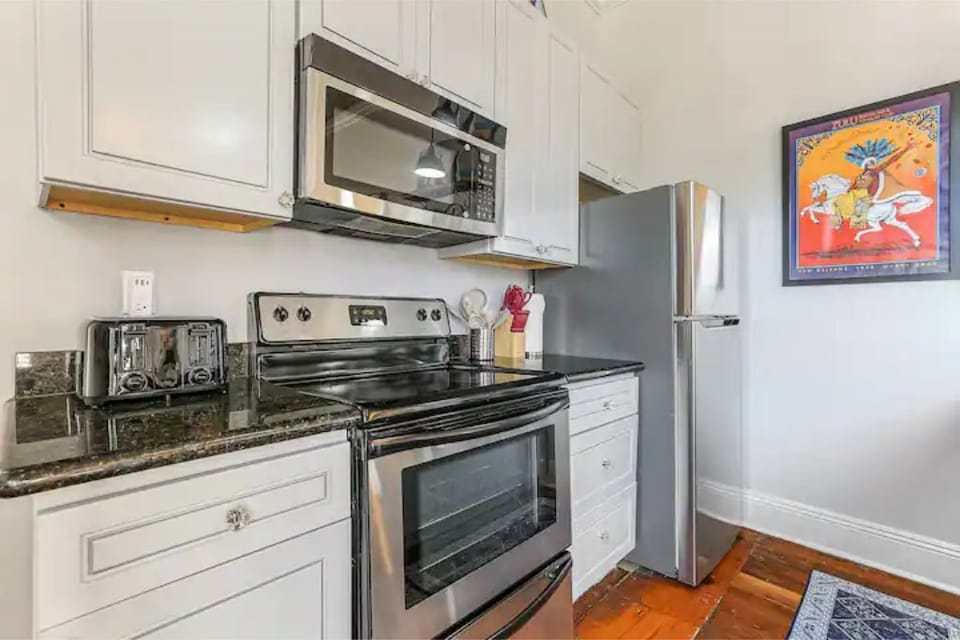 Full size induction stovetop, oven, and fridge with icemaker