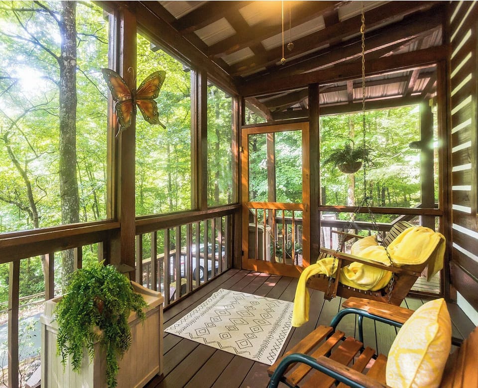 Covered Porch with seating and Porch Swing.