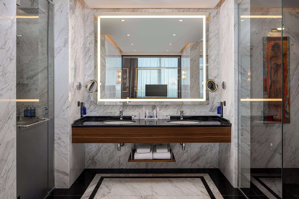 Presidential Suite | Bathroom | Separate tub and shower, rainfall showerhead, designer toiletries