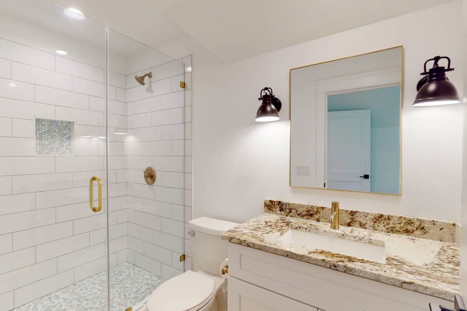 The second owner suite has a private full bathroom with a large walk in shower
