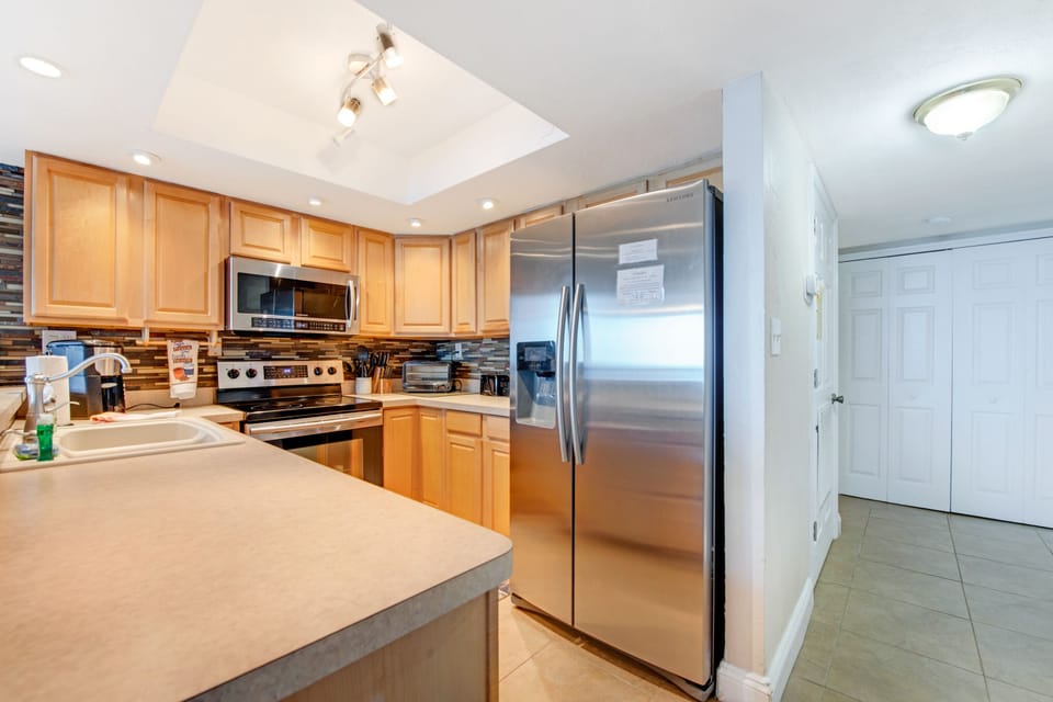Ample counter space and elegant pendant/track lighting.