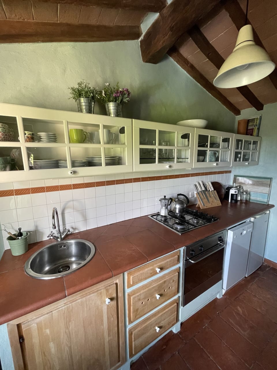 Kitchen with dishwasher, two fridges and stove and  oven