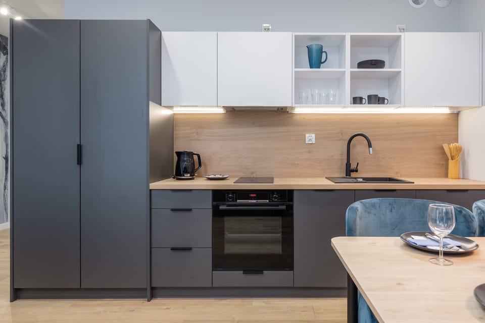 A compact, modern kitchen with a minimalist design.
