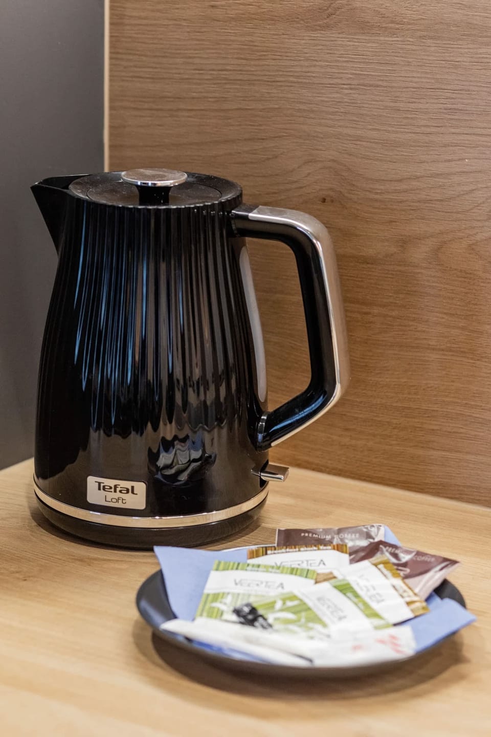 A kettle with coffee and tea prepared for the arrival of guests.
