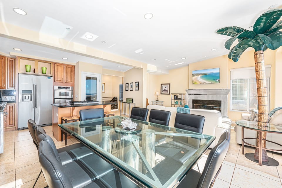 The dining area includes seating for 8.
                