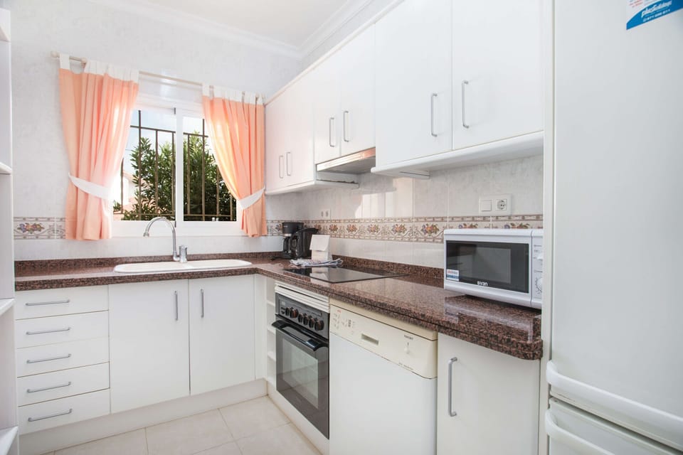 Exceptional holiday villa with private pool located in Calpe (Costa Blanca) for 6 people, with three bedrooms and two bathrooms distributed on a single floor.INTERIOR: This beautiful villa consists of a spacious living room with SAT / DTT TV, air conditioning and exit to the covered terrace and the pool. A fully equipped kitchen with hob and dishwasher. A bedroom with a double bed. One bedroom with two single beds. A bedroom with a double bed, air conditioning and a bathroom with bathtub en suite. In addition there is a separate bathroom with shower.EXTERIOR: Nice plot with diverse plants and trees, with a rectangular 8x4 pool with Roman stairs and outdoor shower. There is a beautiful barbecue to enjoy outdoor food. There is a room with a washing machine and parking for two vehicles on the same plot. The plot is completely closed.LOCATION: An ideal villa to take advantage of the proximity to the beaches and shops it offers. It is only 850 m from the nearest cove and 1.6 km from the sandy beach. The nearest restaurant is 170 m away and the supermarket is 1 km away.OBSERVATIONS: Free WiFi. Pets are allowed up to 12 kg with supplement