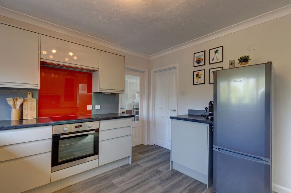 Ground floor: Kitchen with a large fridge and freezer