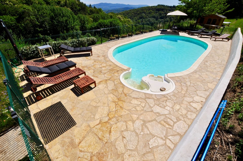 Heated swimming pool, with children's security fence and bathroom facilities