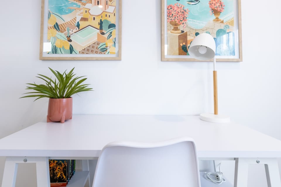 Work or study from home using the provided desk and workspace.