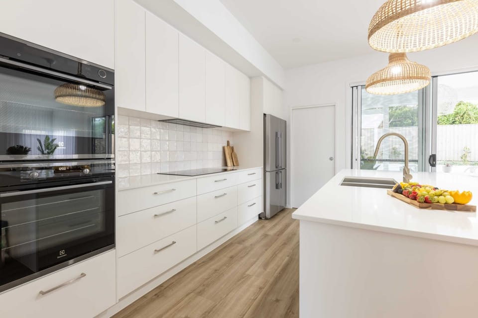 The kitchen is complete with high quality, modern appliances and utensils.