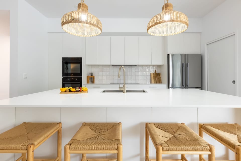 The kitchen is large and spacious, equipped with many appliances and utensils.