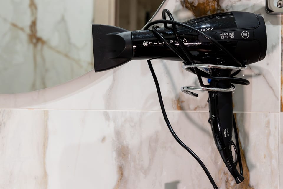 Junior Quadruple Room | Bathroom | Shower, rainfall showerhead, designer toiletries, hair dryer
