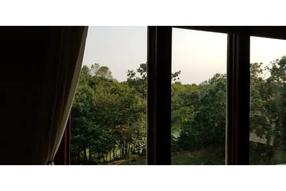 View of backyard from main floor living room/dining room
