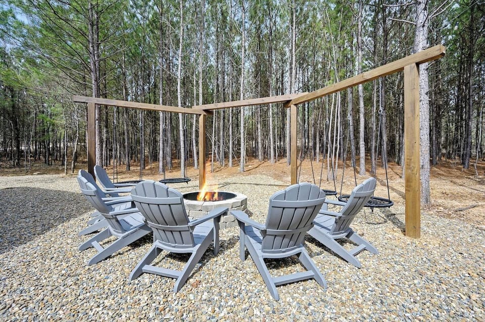 Firepit structure with 4 spider web swings. Please note a large cushioned bench swing was added after this picture was taken. (updated pic coming soon)